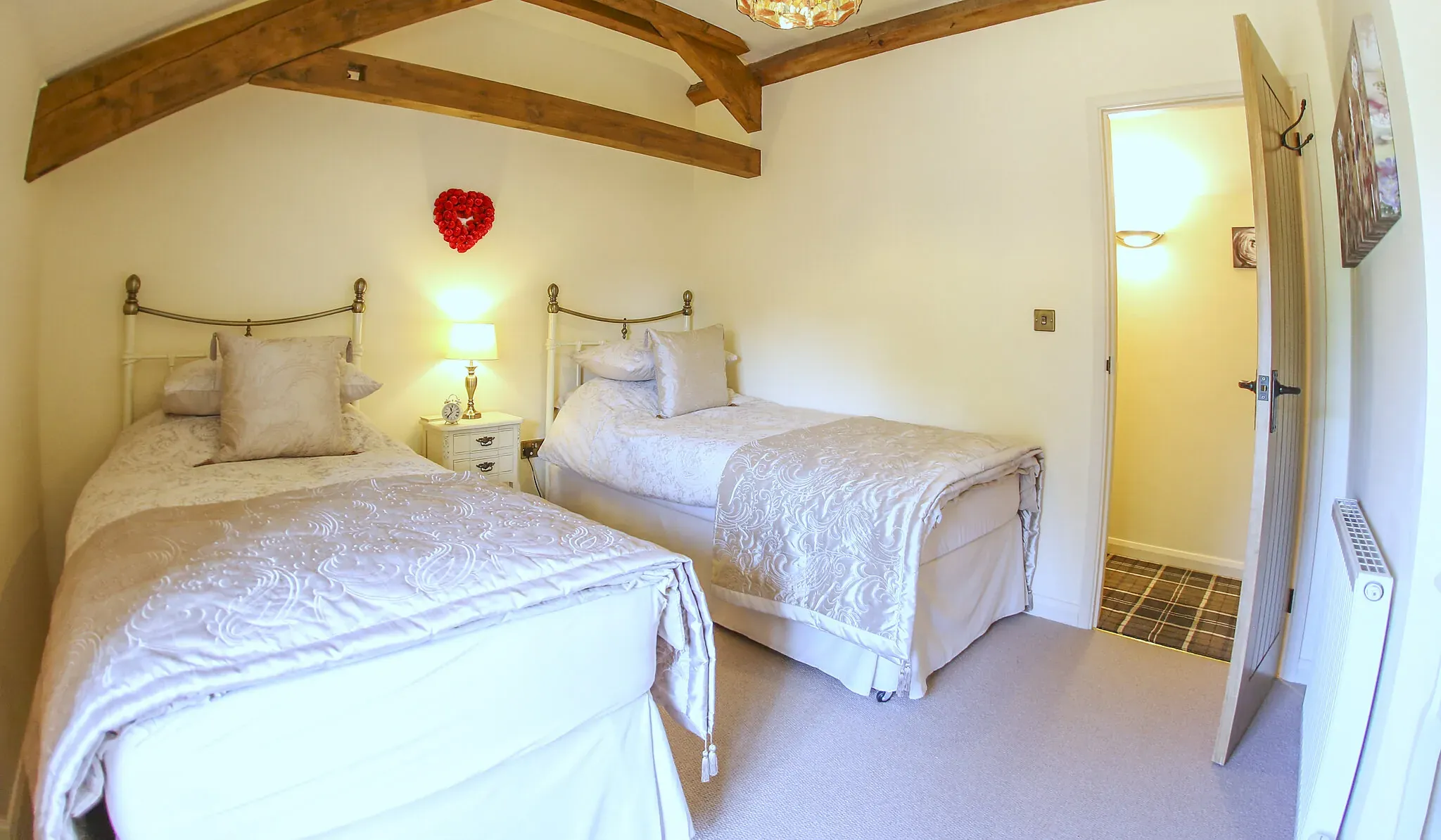 Oak Barn twin bedroom with two single beds and exposed beams